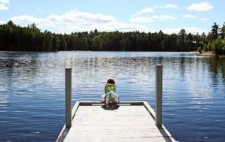 Child on a dock at Moosehead Lake.