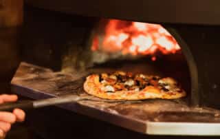 pizza in an oven at a restaurant in westbrook maine