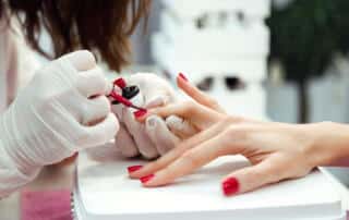 woman getting a manicure at a nail salon in bangor maine