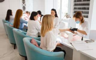 women getting a manicures at a nail salon in portland maine