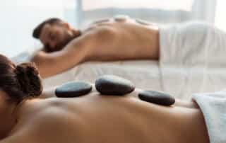 man and woman receiving a stone massage at a spa in portland maine