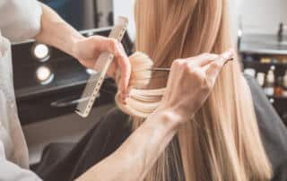A hairdresser and a client at a Bath, ME hair salon