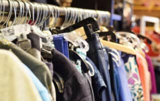 Racks of clothes at a Bath thrift store
