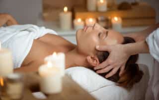 A client at a Kennebunk spa getting a facial massage